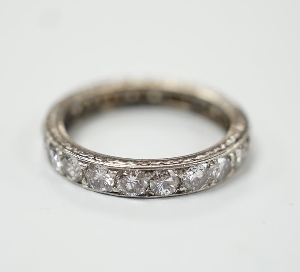 A white metal and diamond set full eternity ring, size L, gross weight 3.1 grams. Fair condition.
